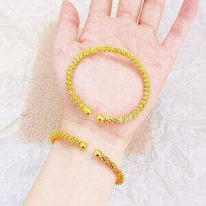 A gold and silver open beaded bracelet (plated copper).